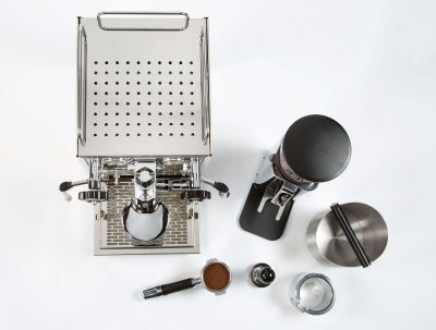 Birds eye view of ECM Mechanika V Slim Coffee Machine with coffee grinder, group handle and coffee tamper