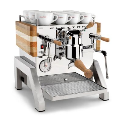 Elektra Verve home coffee machine with group handle attached and a twelve white coffee cups stacked on top of the machine